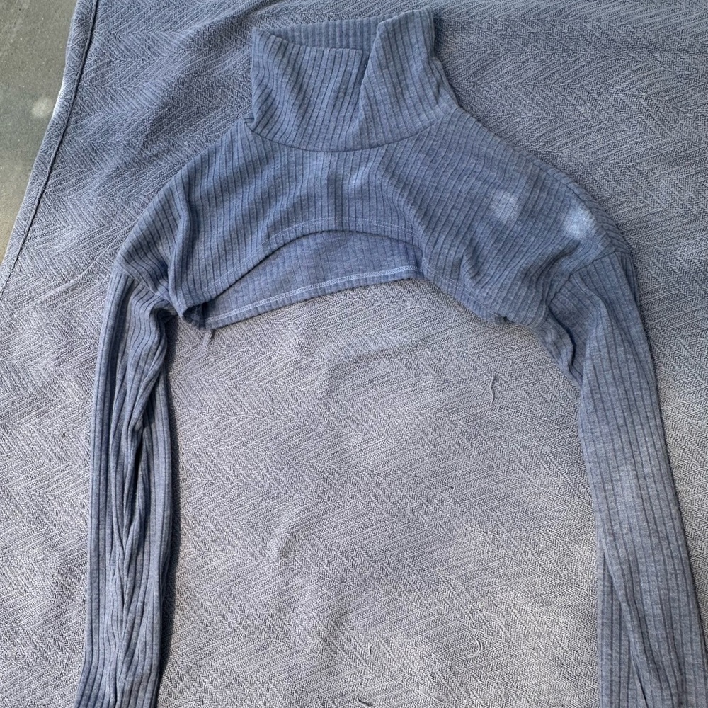 Light blue sweater turtle neck cut out